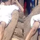 അമ്മയുടെ ആഭരണങ്ങൾ നൽകണമെന്ന് ആവശ്യം; ശവസംസ്കാരം നടത്താൻ അനുവദിക്കാതെ ചിതയിൽ കയറിക്കിടന്ന് മകൻ